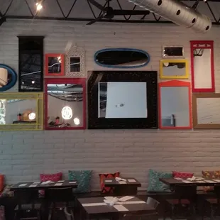 a dining room with a brick wall