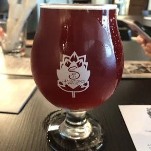 a glass of beer on a table