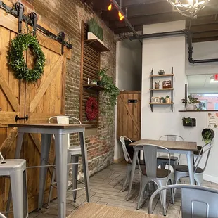 a dining area with tables and chairs