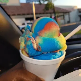 a colorful ice cream in a cup