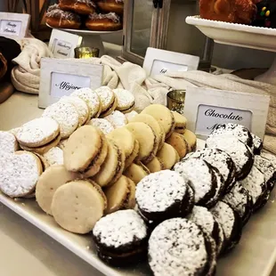a display of cookies and pastries