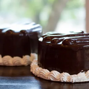 two chocolate cakes on a table
