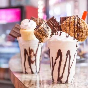 two milkshakes on a counter