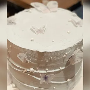 Absolutely delicious Butterfly and Pearl white cake with chocolate buttercream filling by Sweet Art Cakes &amp; Desserts.