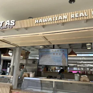 Front of the kiosk, order on the right side.