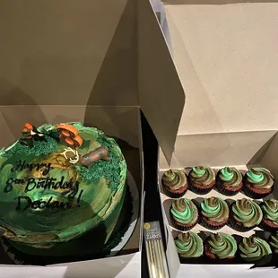 a cake and cupcakes in a box