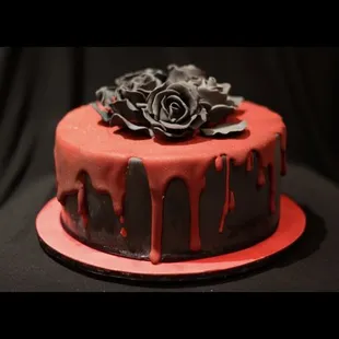 a chocolate cake with red icing
