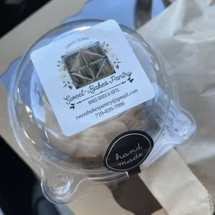 a donut in a plastic container