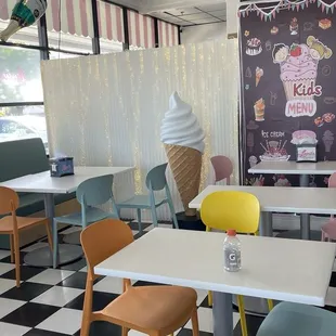 Cute interiors! Lots of tables and chairs to sit