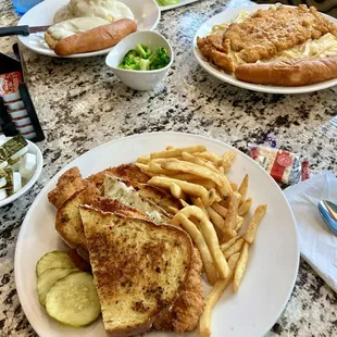 Garlic Crusted Chicken Panini in front Country Fried Steak Dinner in back and Garlic Crusted Chicken Alfredo Pasta Dinner on right..