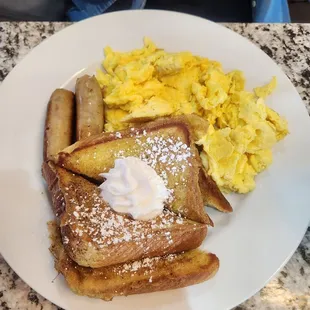 French Toast, scrambled eggs and sausage.