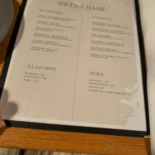 a menu on a wooden table