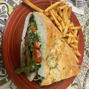 a sandwich and french fries on a plate
