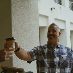 Guest happy to finally get some coffee!