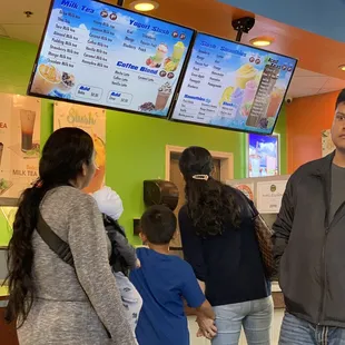 Guests looking for someone to help them, but hey, she's busy on the phone so she can't help customers.