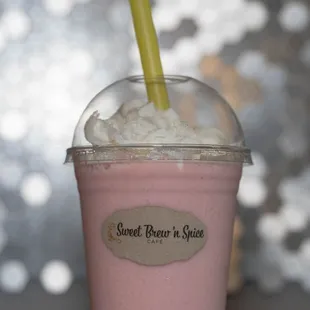 Our mouthwatering strawberry banana smoothie topped with whip cream!