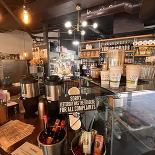 Behind the counter.