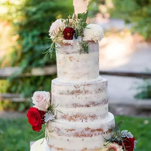 a wedding cake with flowers