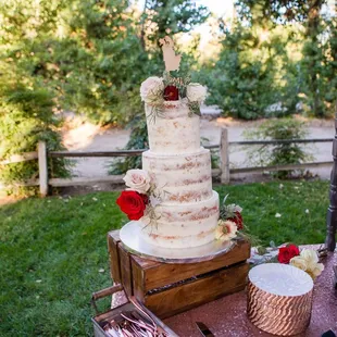 a wedding cake and cupcakes