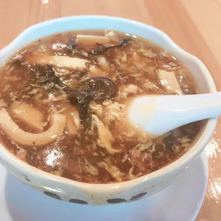 a bowl of soup with a spoon in it