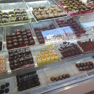 Multiple flavors of caramels and truffles from their display case