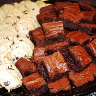 a plate of brownies and cookies