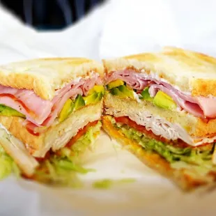 Turkey Ham Triple Decker with Avocado on Toasted Sourdough.  Chinitos will haunt your dreams...