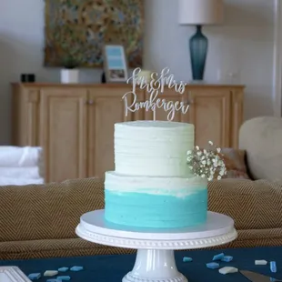 a blue and white cake on a table