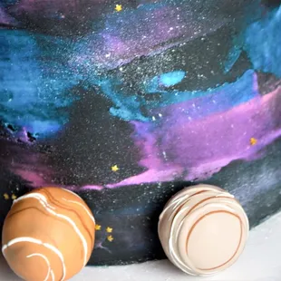a cake decorated with planets