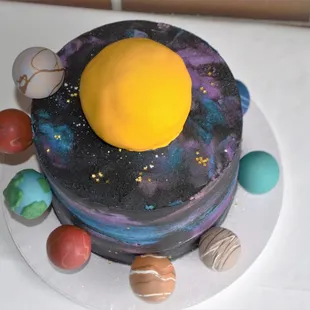a cake with planets on it