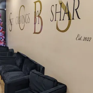 a row of black couches