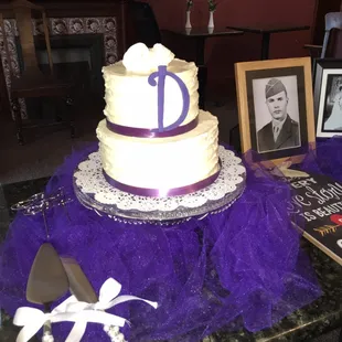 a wedding cake with purple tulle