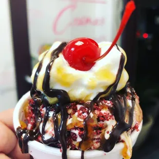 an ice cream sundae with a cherry on top