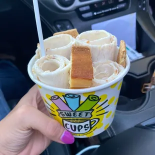  person holding a cup of ice cream