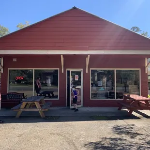 a man standing in front of a store