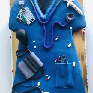 a cake made to look like a doctor's uniform