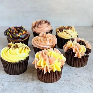 a variety of cupcakes on a table