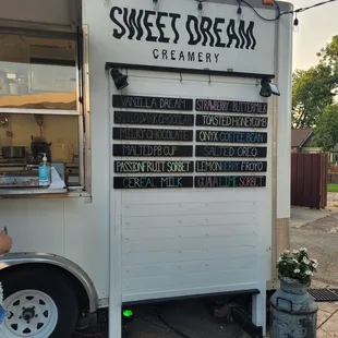a man standing in front of a sweet dream creamery truck