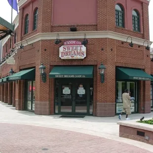 a brick building with a green awning