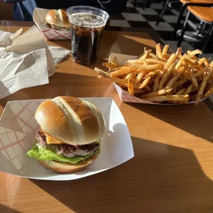 a hamburger and french fries on a table