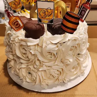 How about a about a bourbon infused cak, not only did it look and taste wonderful she went out of her way and pick up his favorite bourbon!