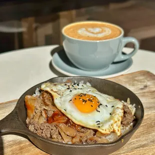 Mama Hwang&apos;s Bulgogi Skillet - Rib-eye marinated in Mama Hwang&apos;s sweet soy sauce.caramelized onion &amp; housemade gochujang sauce