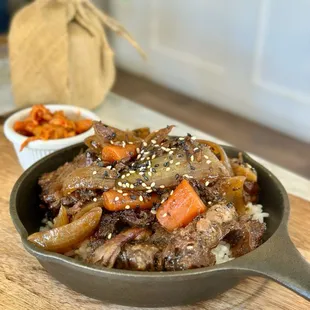 MAMA HWANG&apos;S KALBI JJIM aka STEW - Slowly braised short rib in Mama Hwang&apos;s sweet soy sauce served over rice.
