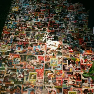 OUR FLOORING ON OUR VINTAGE/THRIFT SIDE. Covered in over 1000 baseball, basketball, and football cards!
