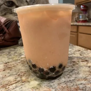 Milk Tea (black tea; strawberry and mango) with boba (regular tapioca).