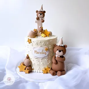 a birthday cake with teddy bears