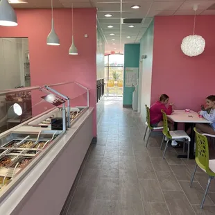 a cafeteria with people eating