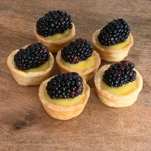Blackberry lilikoi cheesecake tarts made with homemade lilikoi curd.