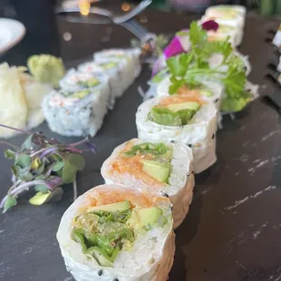 a sushi roll with avocado and salmon