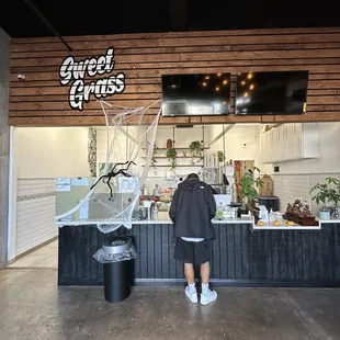 a man standing in front of a counter